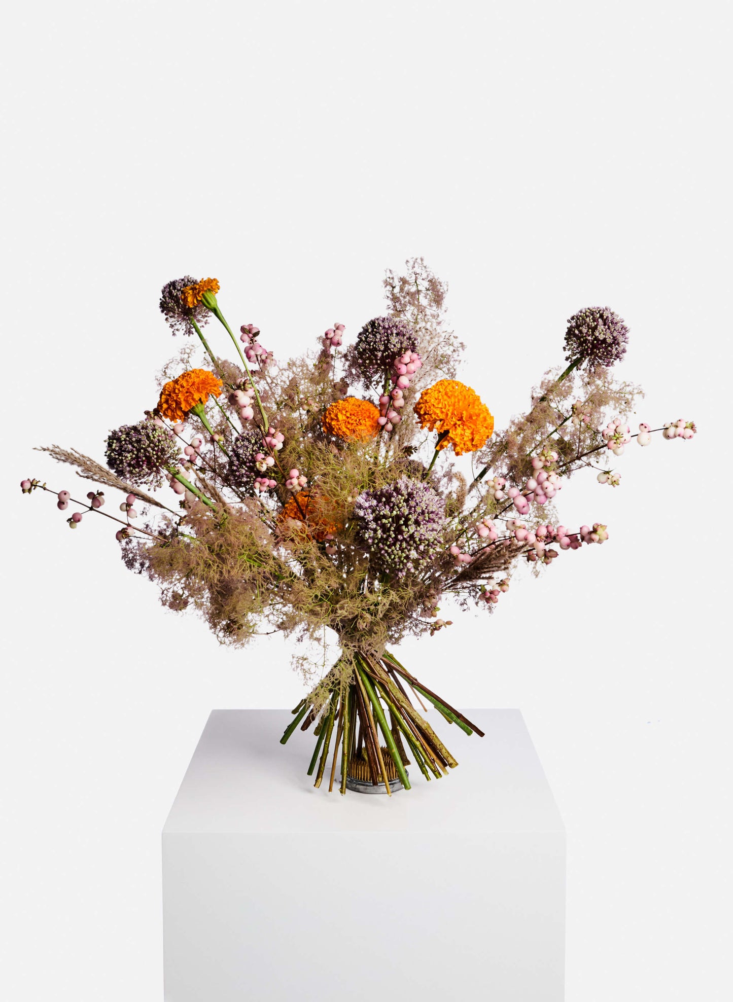 A vibrant seasonal flowers bouquet featuring allium, marigold, smoke tree and berries. Free delivery Hong Kong.