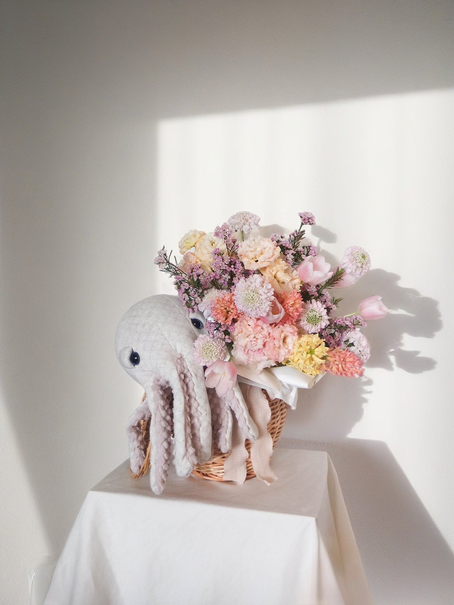 Hong Kong Gift hamper.Seasonal pastelish flower bouquet, mini stuffed animal in a woven basket with cotton lining and lid