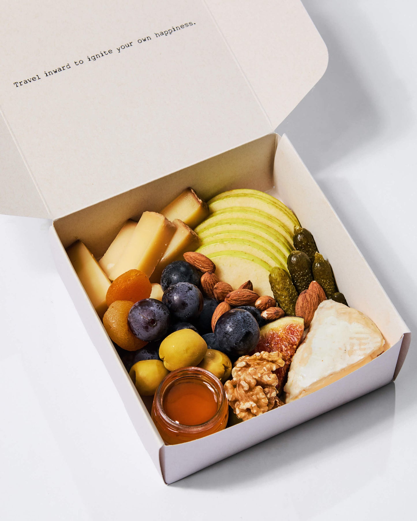 A cheese box of our selection of nicely cut finest cheese and cold cuts with antipasti, nuts, fresh & dried fruits, vegetables, mini honey pots, topped with seasonal garnishes. Comes ready to eat. The perfect pick for home parties, corporate event or as a gift.