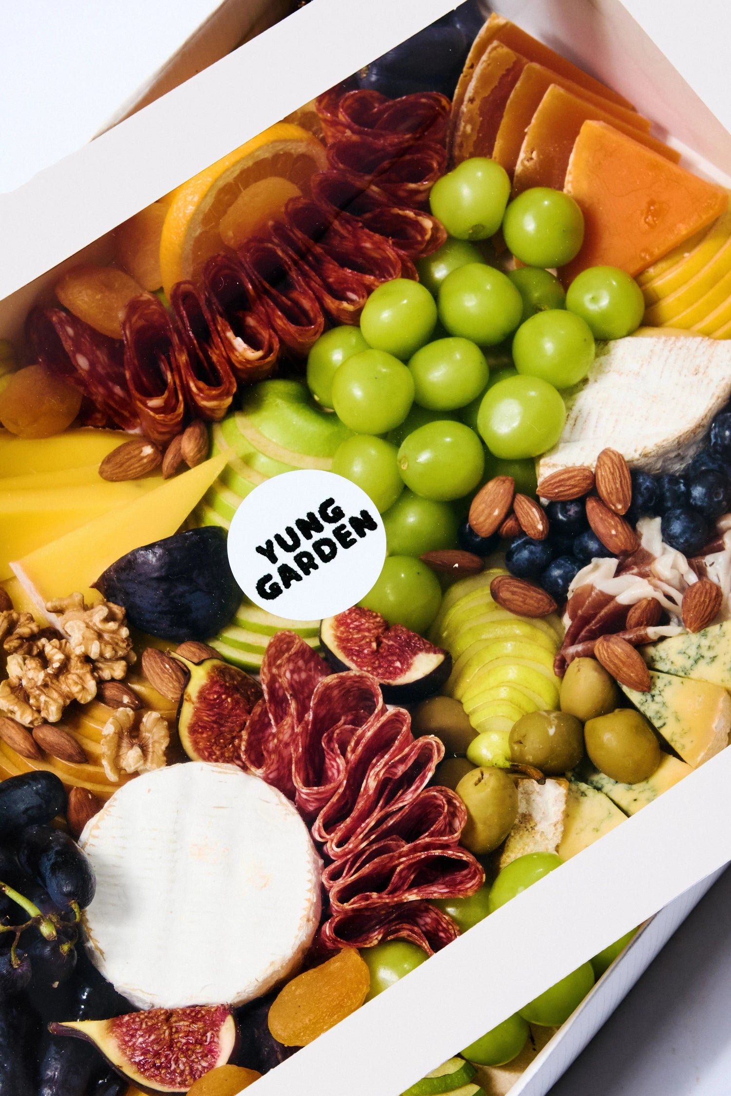 Cheese platter with our selection of finest cheese and cold cuts with nuts, fresh & dried fruits, honey & chutney pots, topped with seasonal garnishes. Comes ready to eat. The perfect pick for home parties, corporate event or as a gift.